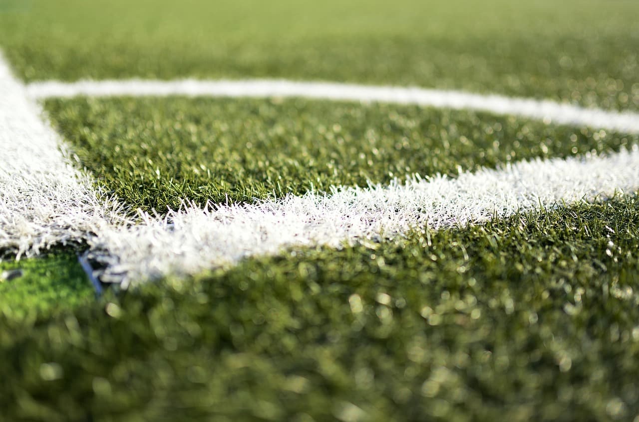 Empty football pitch marked with white lines